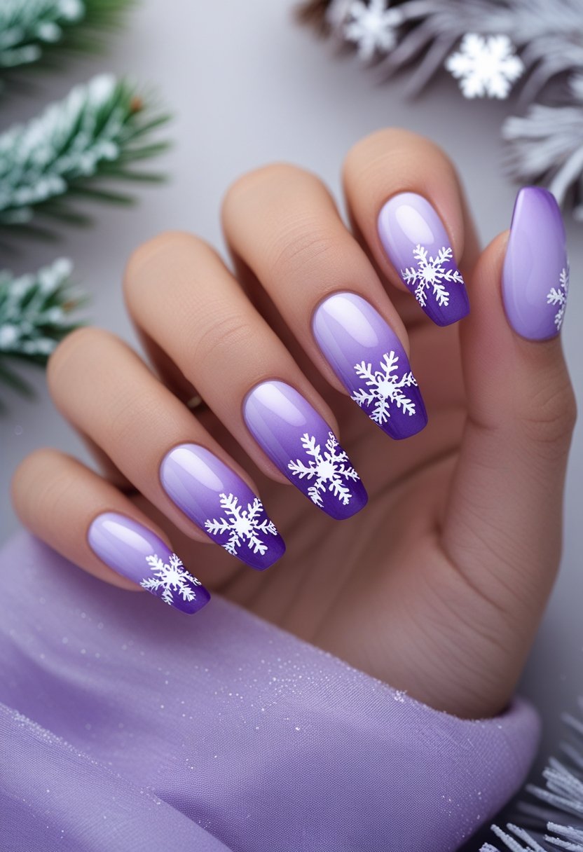 Close-up of a hand with purple gradient nails decorated with white snowflake designs resting on a soft background with winter-themed elements.